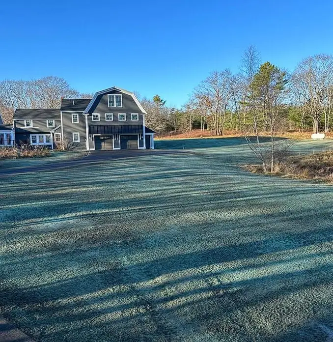 Freshly hydroseeded lawn at a coastal Maine property