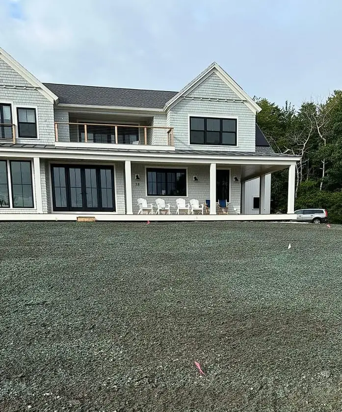 Freshly hydroseeded lawn at a new construction home in Maine