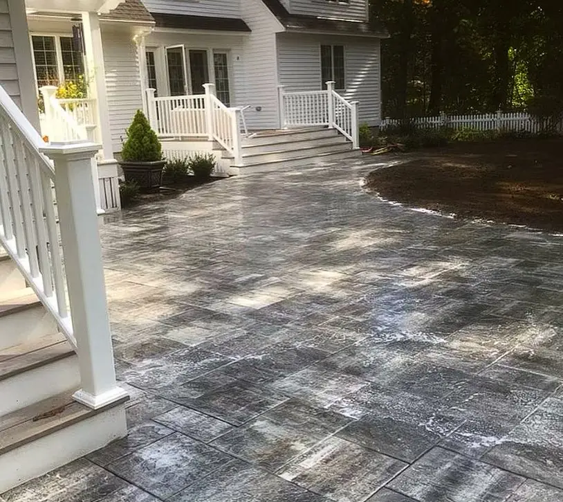 Paver patio installation at a home entryway in Southern Maine