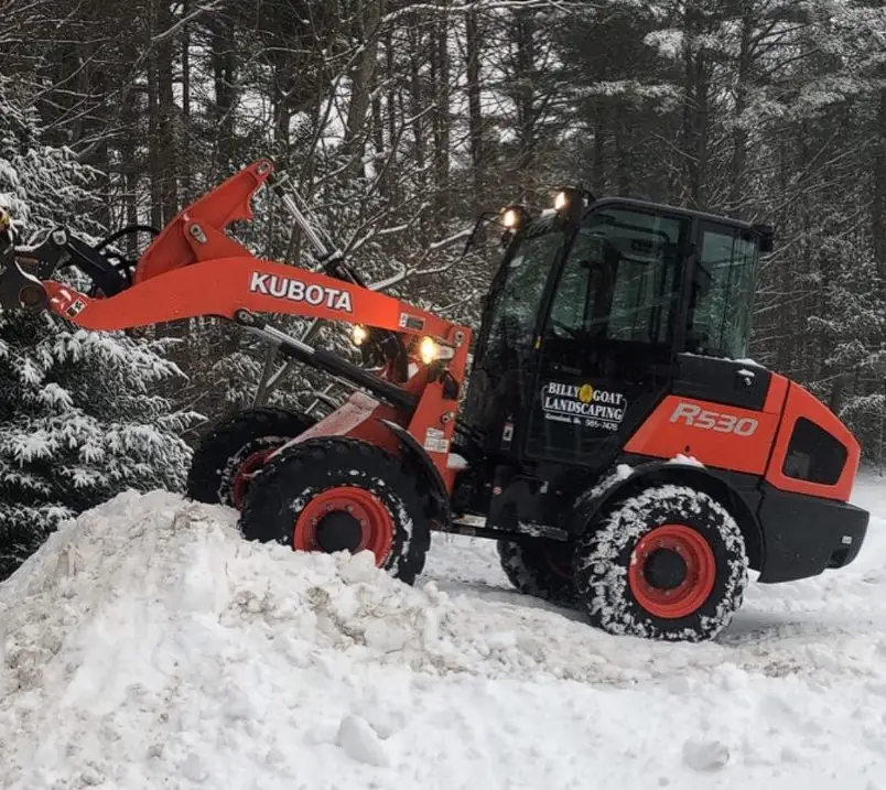 Kubota loader plowing snow for Billy Goat Landscaping in Southern Maine