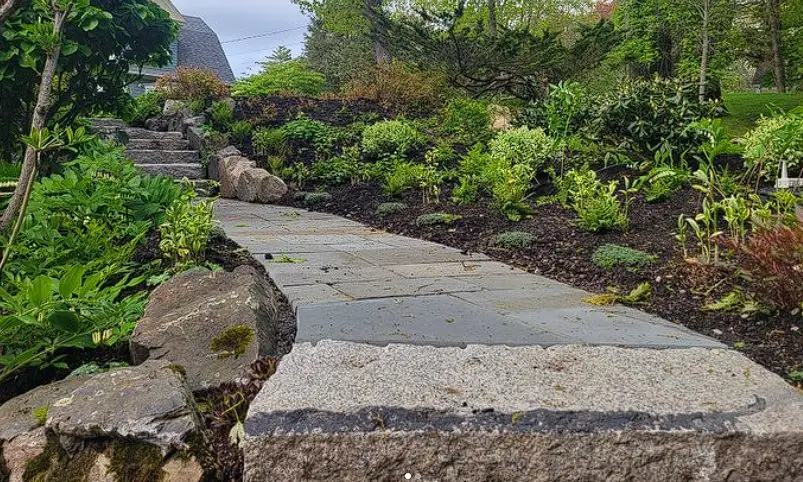 Stacked stone garden steps and landscaped path installed by Billy Goat Landscaping in Kennebunk, Maine